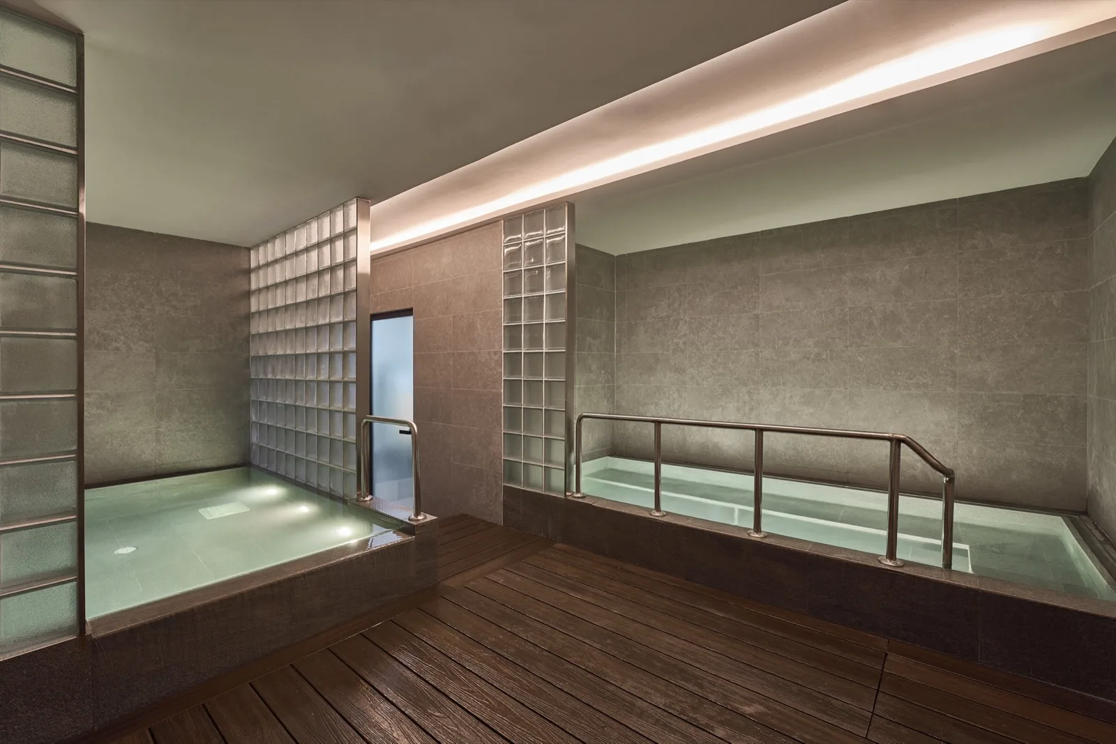 A cold plunge in the warm Sauna Bath House space.